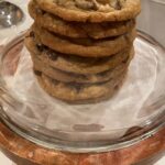7 Chocolate Chip Cookies Stacked in a Display Container