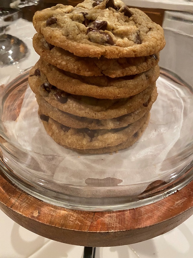 7 Chocolate Chip Cookies Stacked in a Display Container